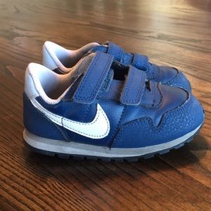 Toddler size 7 blue and white Nikes.